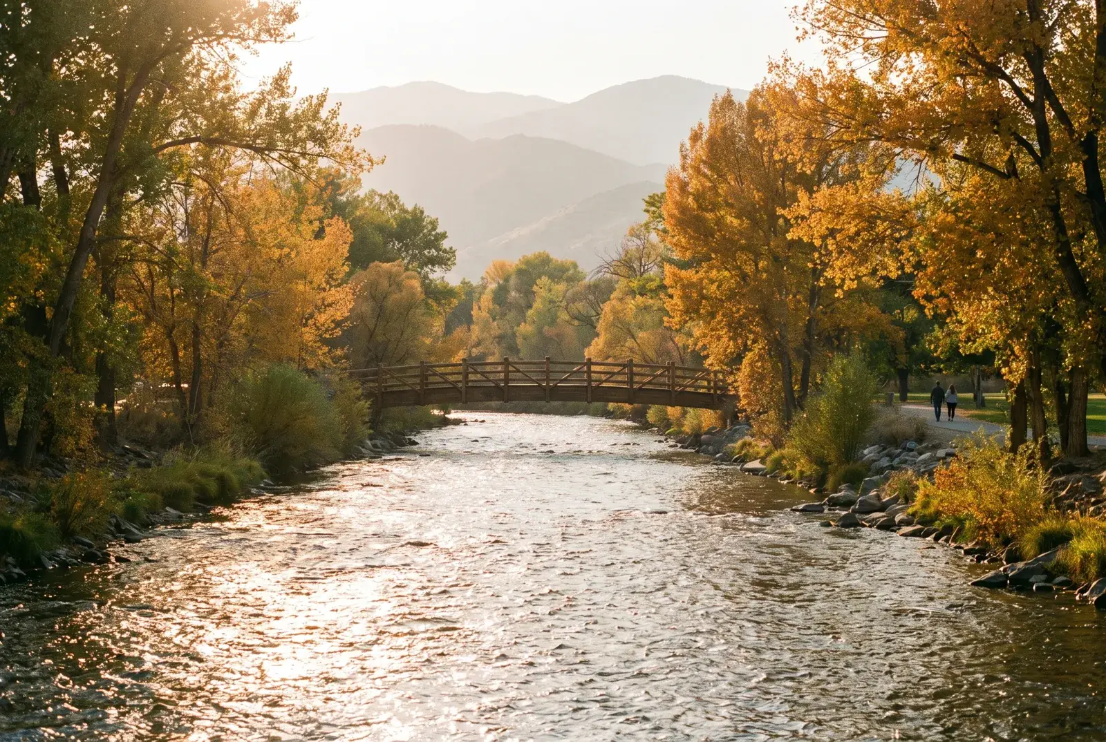 The Truckee River in autumn light, a footbridge crossing between cottonwoods